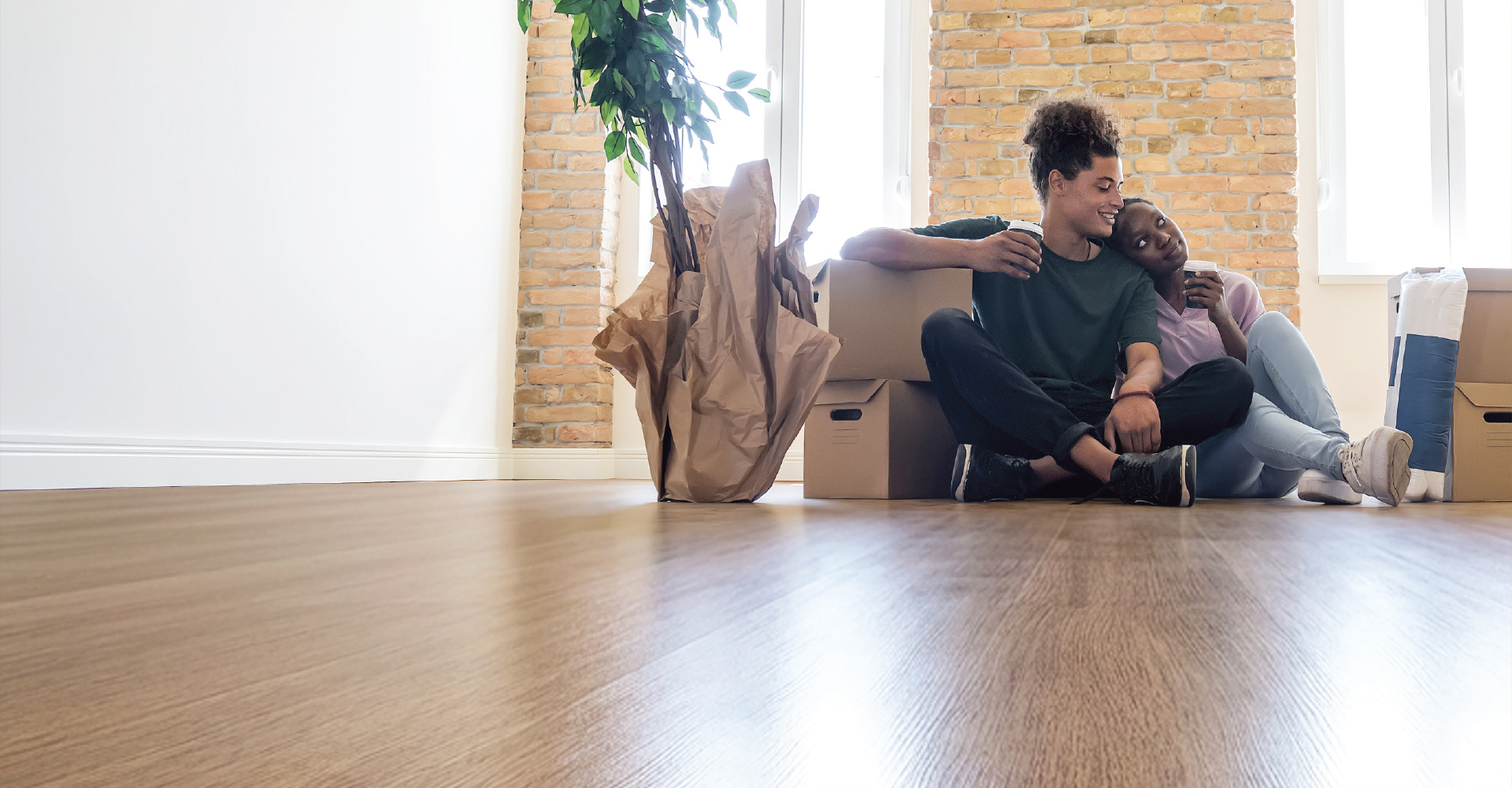 Couple sitting on Luxury Vinyl Floor